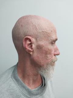 Side mugshot image of Craig Henry Post