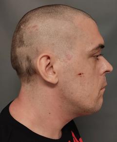 Side mugshot image of William Robert Gomes