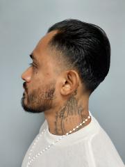 Side mugshot image of Johnny  Torres