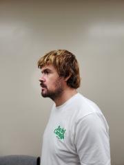 Side mugshot image of Christopher  Bratcher