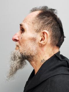 Side mugshot image of Darrell  Reagan