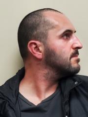 Side mugshot image of Andrew Anthony Scharff