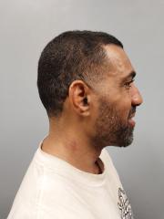 Side mugshot image of Paul Levi Jack Peraza
