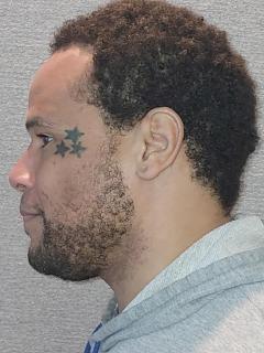 Side mugshot image of Jordan Pavonn Pasqua Payne