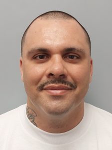 Front mugshot image of Miguel Angel Huezo