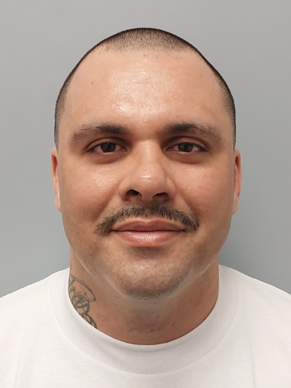 Front mugshot image of Miguel Angel Huezo