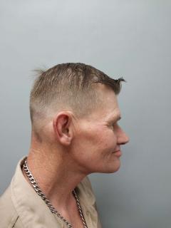 Side mugshot image of Dennis Stuart Serba