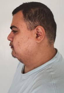 Side mugshot image of Theodore Teddy Ozaki