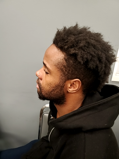 Side mugshot image of James Markise Britton