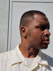 Side mugshot image of Walter Bishope Reed