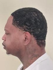 Side mugshot image of Wilford Leon Lewis