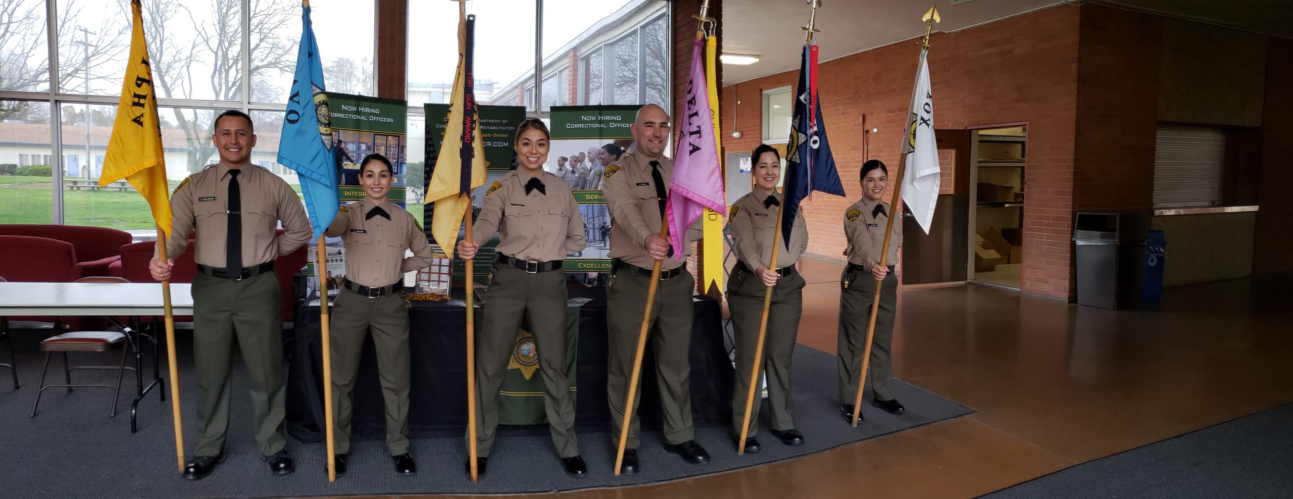 CDCR staff holding flags