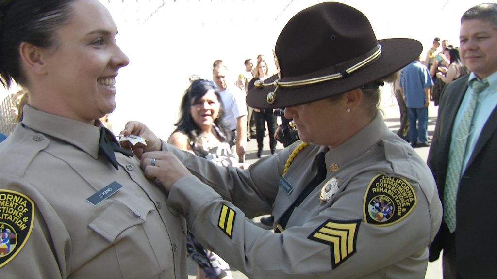 Officer badge pin at graduation