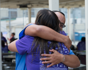 two people hugging through rehabilitative programs