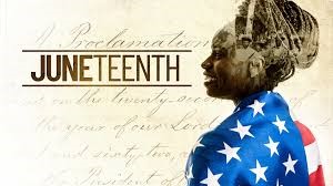 African American woman wrapped in American flag with Juneteenth logo