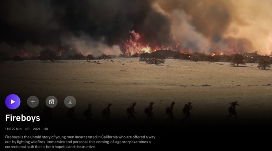 Screenshot of Fireboys documentary opening screen - a young fire crew in shadows walks toward a wildfire