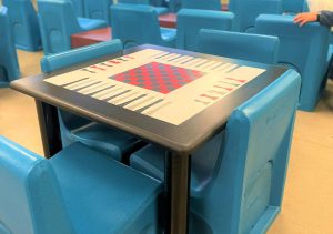 Large polyurethane blue chairs and a game table