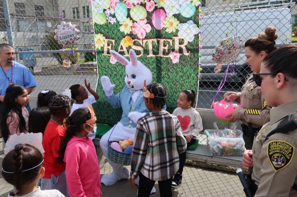 The Easter Bunny takes photos with children