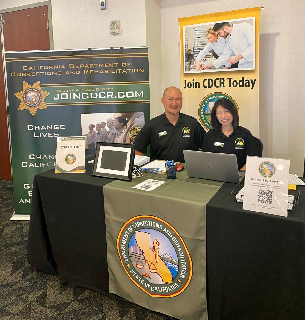 CDCR recruiting table with two people