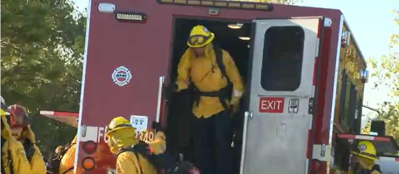 fire crew exiting firetruck
