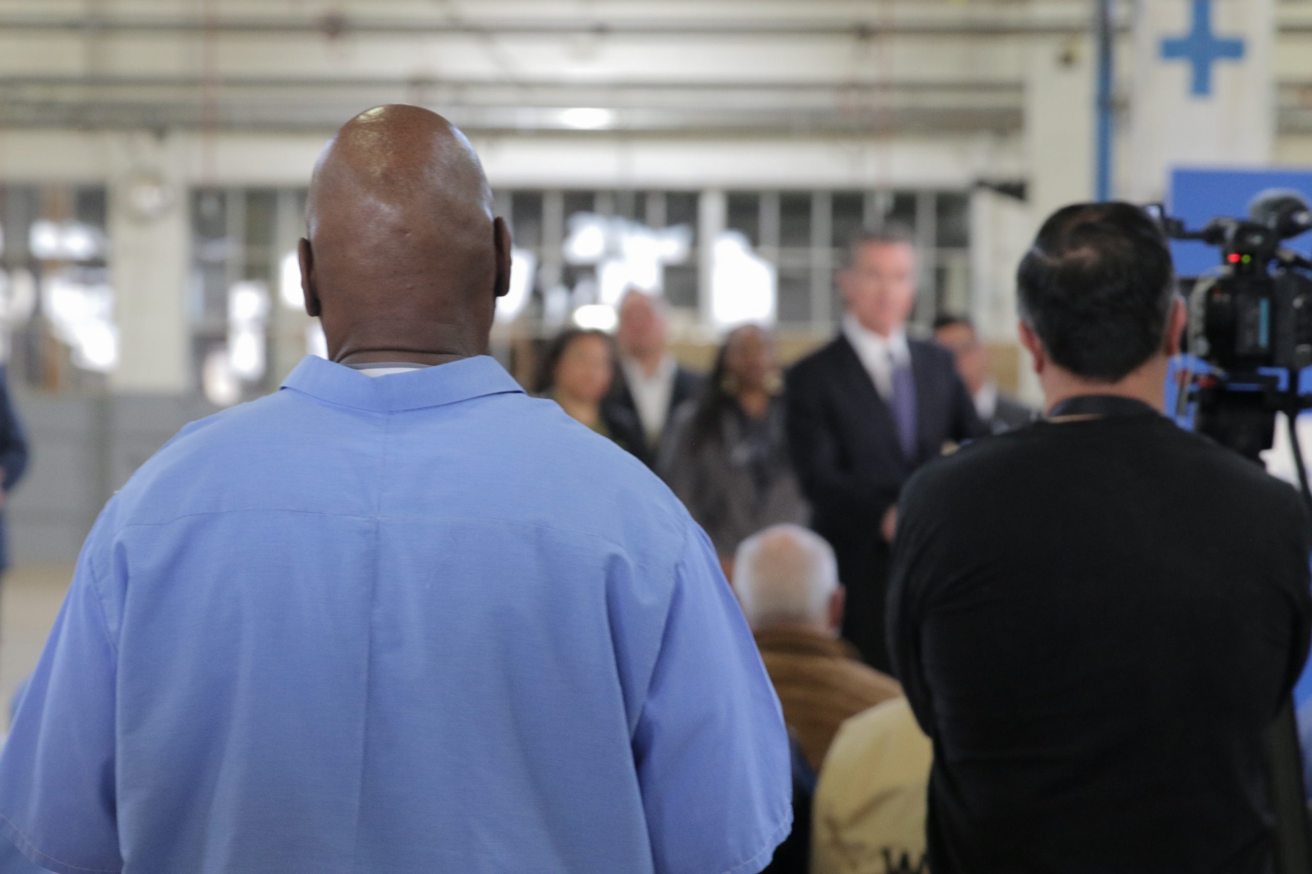 An incarcerated person faces away from the camera during a Q&A with Governor Newsom