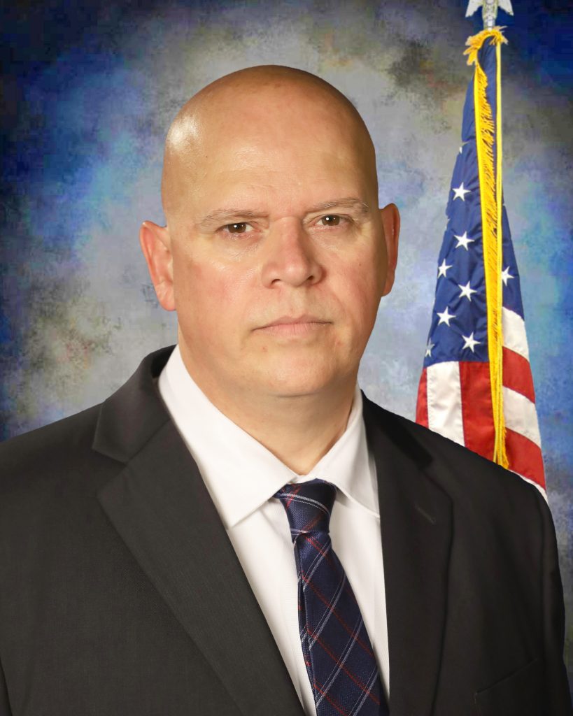 Edward J. Silva, Warden.