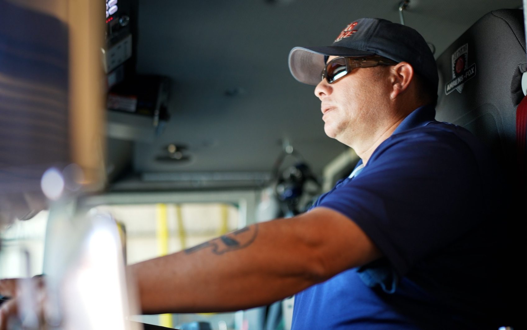 Fire Captain Ries, with CCWF, in a fire engine.